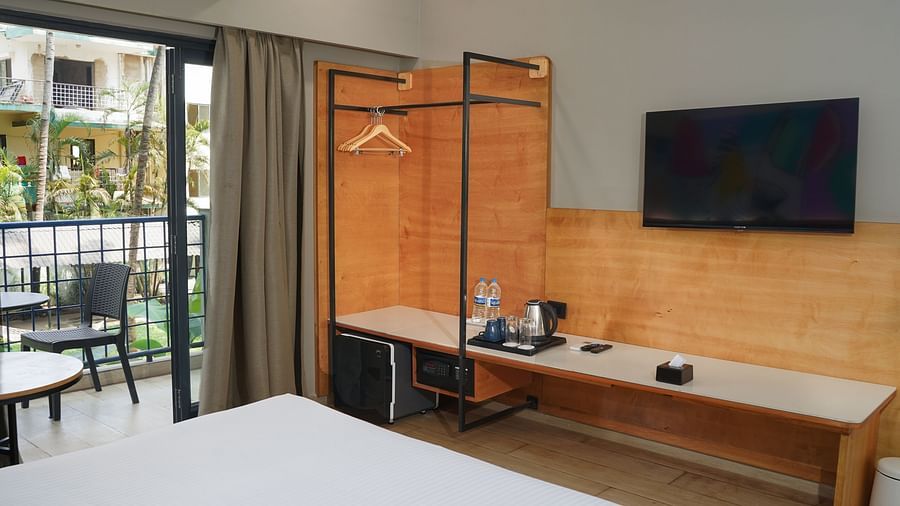 A view from the bed of a television in Cozy Double Room at Indie Stays Resort, Goa.